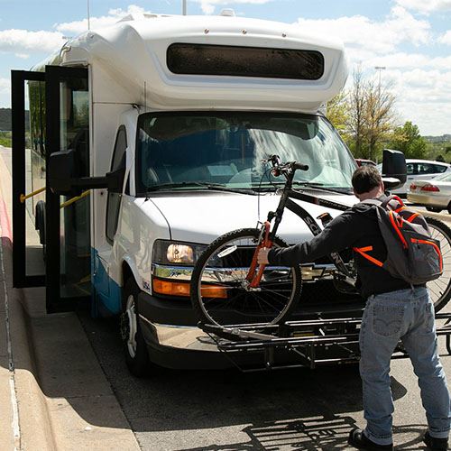 Man loading bike onto Ozark Regional Transit Bus